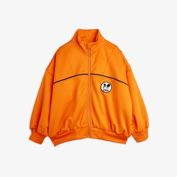Orange recycled polyester tracksuit jacket featuring a Ritzratz patch, navy piping, and ribbed cuffs.