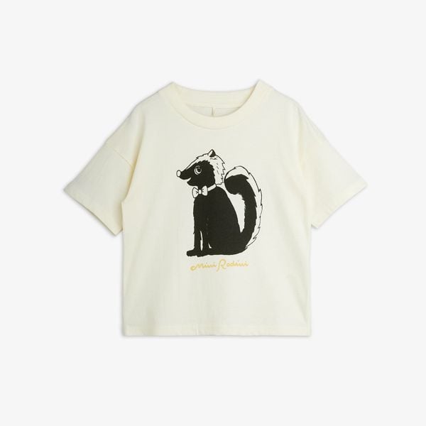 Off-white short-sleeve top featuring a black and white Skunk print with a bow tie on the chest.