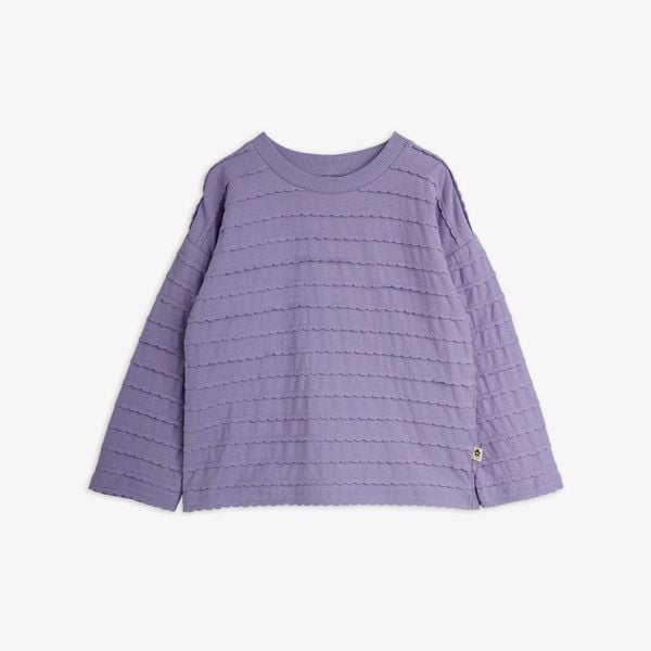 Purple long-sleeved top featuring horizontal rows of textured frills and a rounded neckline.
