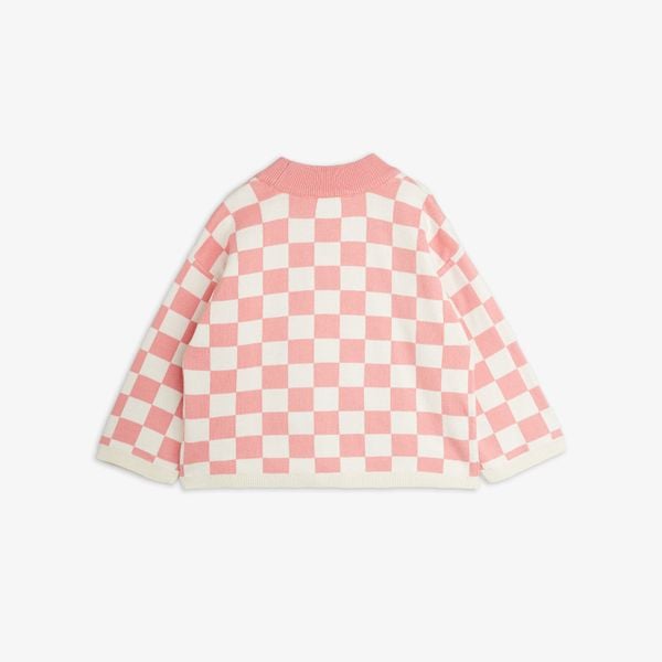 Pink and cream chess check knitted sweater with ribbed trims, shown from the back.