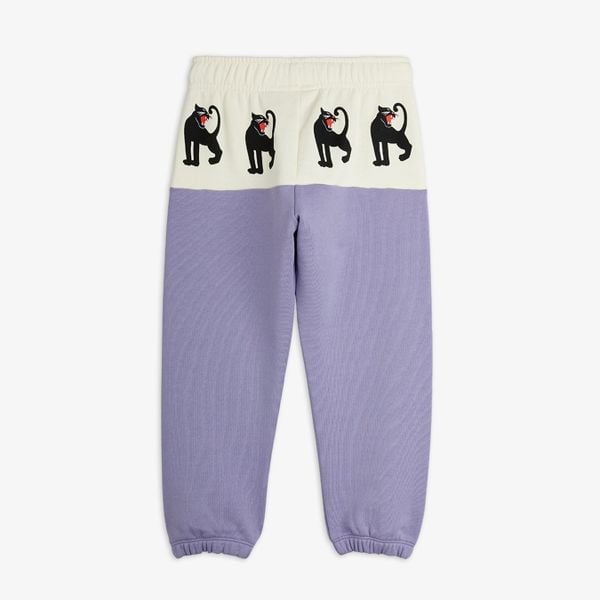 Purple sweatpants featuring a cream waistband panel with black Panther prints, shown from the back.