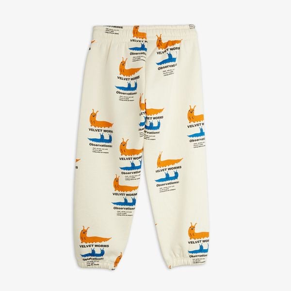 Off-white sweatpants featuring an all-over Velvet worms print, shown from the back.