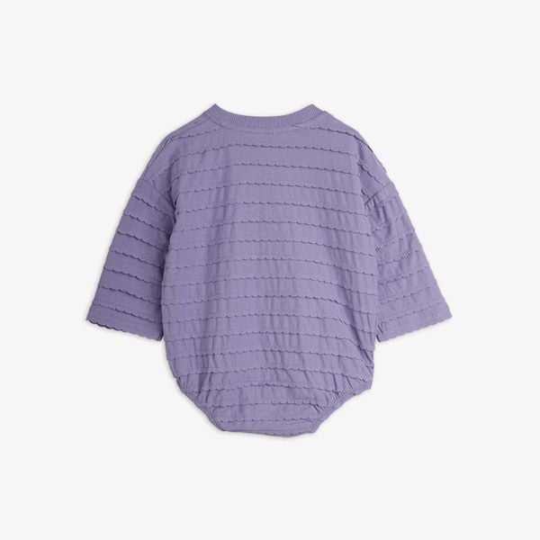 Purple long sleeve bodysuit featuring rows of textured frills on the back.