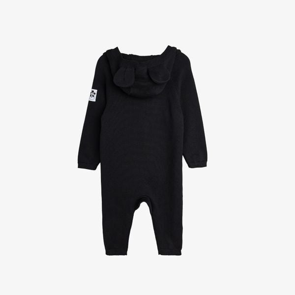 Black fine knit baby jumpsuit with a mouse-ear hood and panda label, seen from the back.
