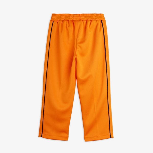 Orange Ritzratz trousers in recycled polyester with an elasticated waistband and navy striped side-piping, back view.