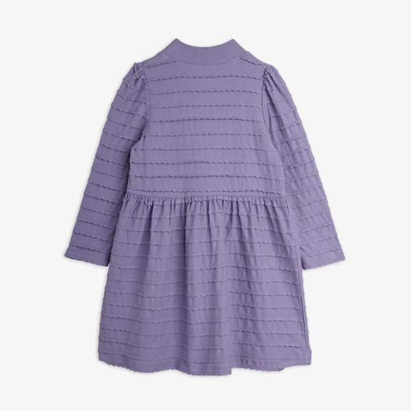 Purple long-sleeved dress featuring all-over scalloped textured frills and a gathered waist, shown from the back.