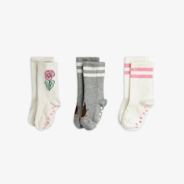 Three pairs of white and grey anti-slip socks with Elephant shrew, flower, and pink stripes.
