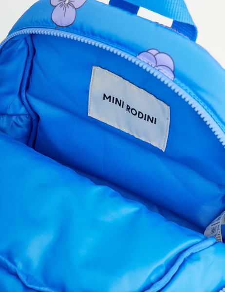 Close-up of the blue padded backpack interior featuring the Mini Rodini brand label.
