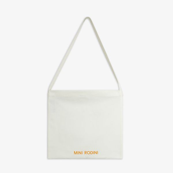 Off-white tote bag featuring long handles and an orange Mini Rodini logo print at the bottom.