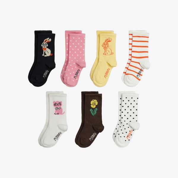 Multi-colored 7-pack of ribbed socks with rabbit, cat, and flower motifs, stripes, and polka dots.