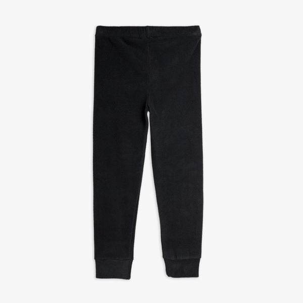 Black microfleece trousers featuring an elastic waistband and ribbed cuffs at the leg openings.