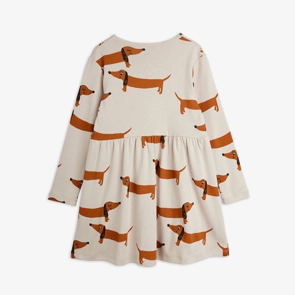 Grey long-sleeved dress with an all-over print of brown dachshund dogs and a gathered waist.