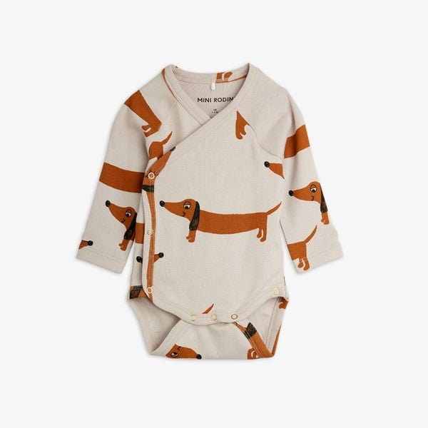 Grey long-sleeved wrap bodysuit featuring an all-over brown dog print and snap buttons.