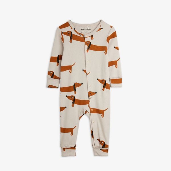 Grey organic cotton jumpsuit featuring an iconic dog print and snap buttons.