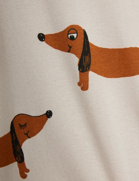 Close-up of a grey t-shirt featuring a repeating brown Dog print.