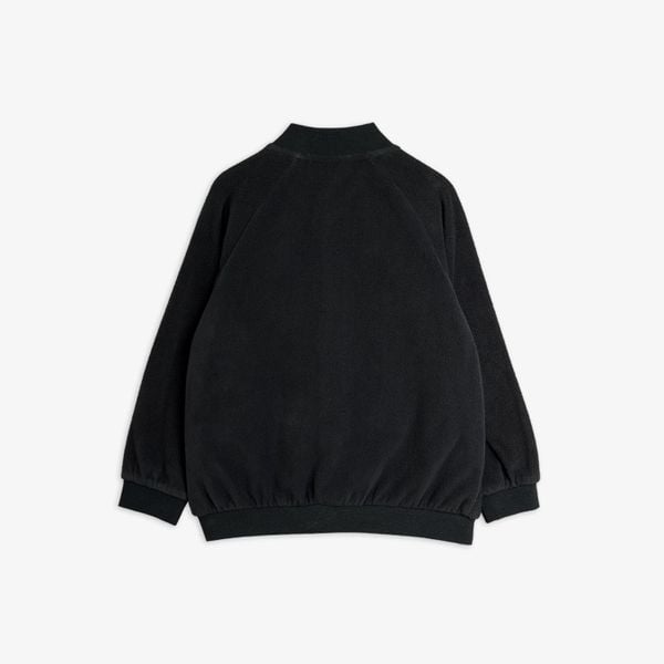 Black microfleece jacket with ribbed cuffs and hem, viewed from the back.