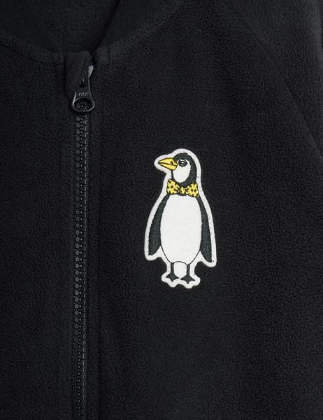 Black microfleece jacket featuring a zipper and a penguin patch with a yellow bow tie.