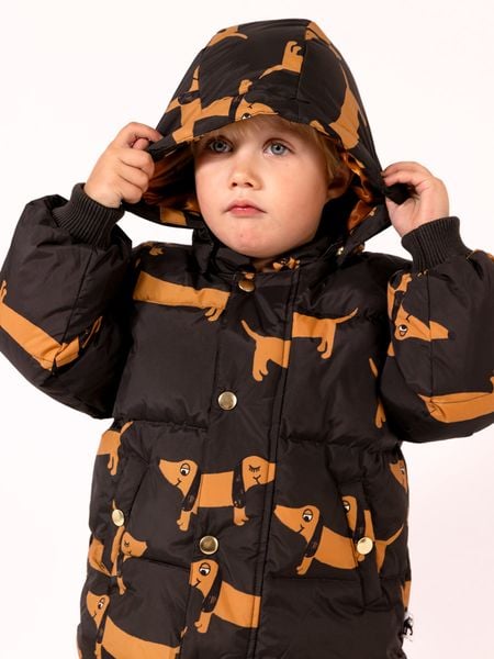 Black hooded puffer jacket featuring a Dog print and snap buttons.