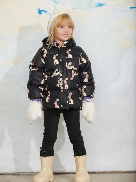 Black hooded puffer jacket featuring a rabbit pattern, worn by a child.