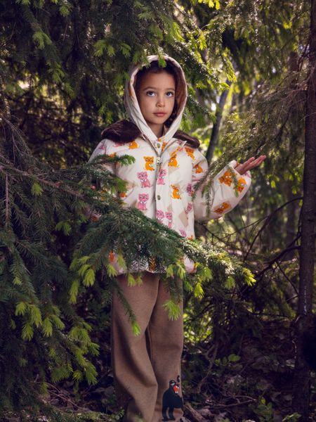 Padded puffer jacket featuring a Kittens print, faux fur collar, and removable hood, worn by a child.