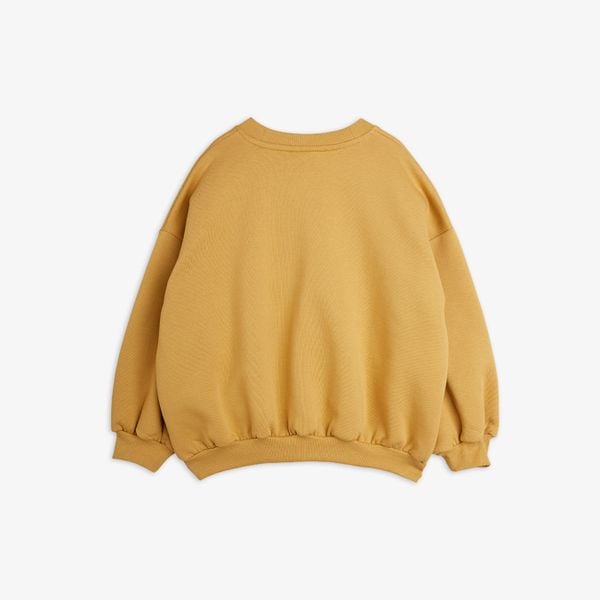 Beige sweatshirt seen from the back featuring a crew neck and ribbed trims.