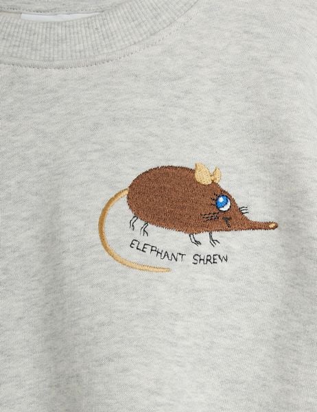 Elephant shrew embroidery detail on a grey melange sweatshirt.