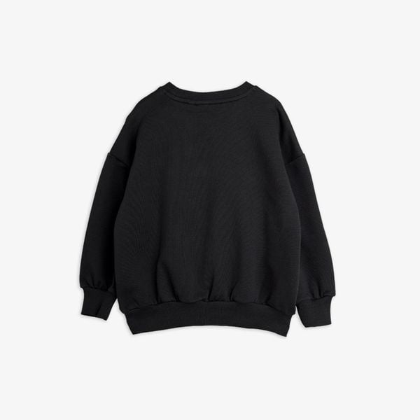 Black sweatshirt shown from the back with dropped shoulders and ribbed trims.
