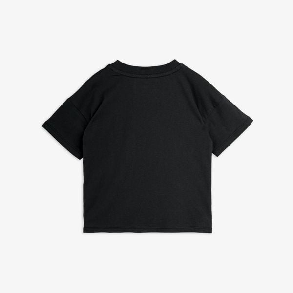 Black short-sleeved t-shirt shown from the back, featuring dropped shoulders and a ribbed neckline.