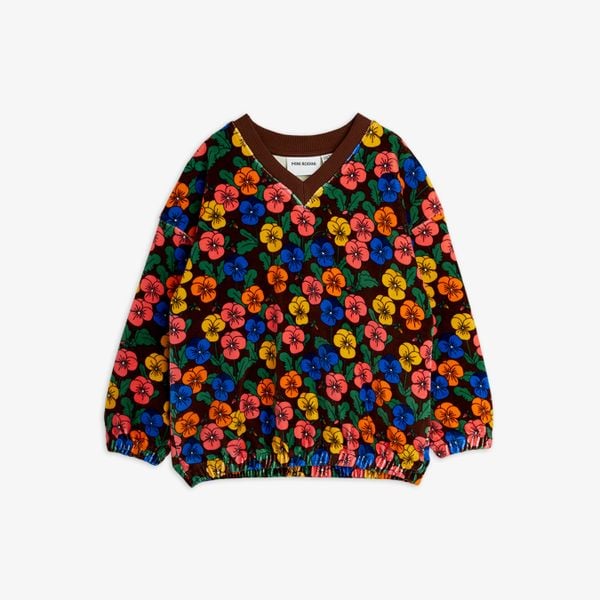 Velour sweatshirt with a colorful Viola flower print, featuring a brown ribbed V-neck and elasticated cuffs.