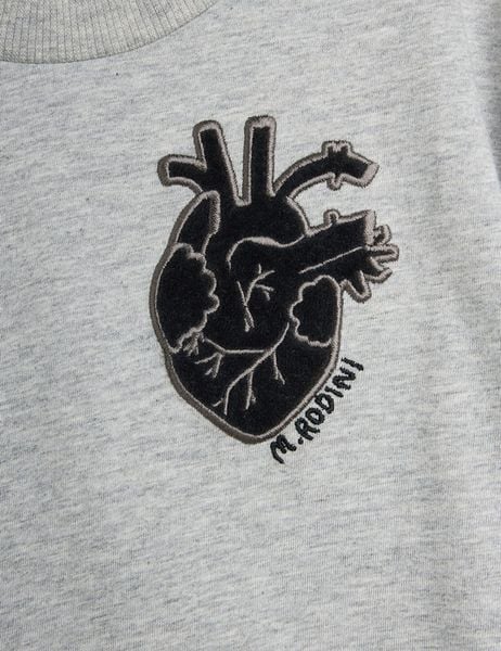 Black anatomical heart application and M. Rodini embroidery on grey melange fabric.