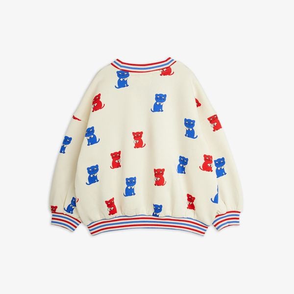 Off-white sweatshirt with a red and blue Kittens print and striped ribbed trims.