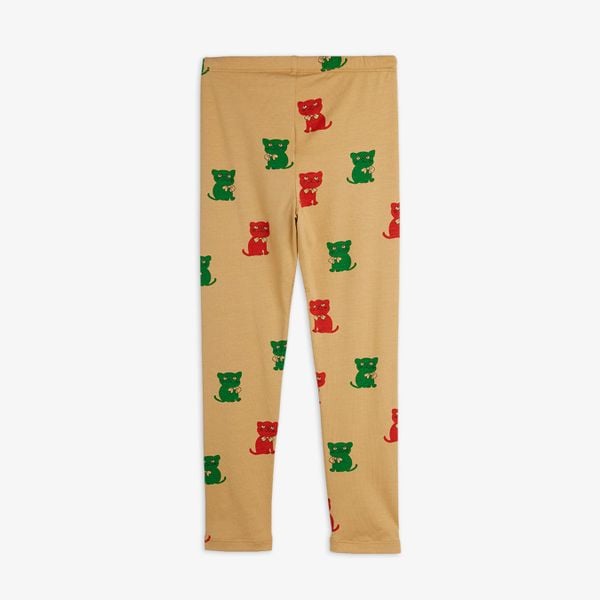 Beige leggings featuring a red and green Kittens print and an elastic waist.