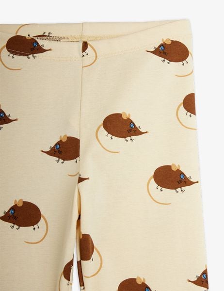 Beige leggings featuring an all-over brown Elephant shrew print and elastic waist, shown in close-up.