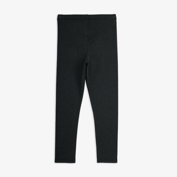 Black organic cotton leggings with an elastic waistband, shown from the back.