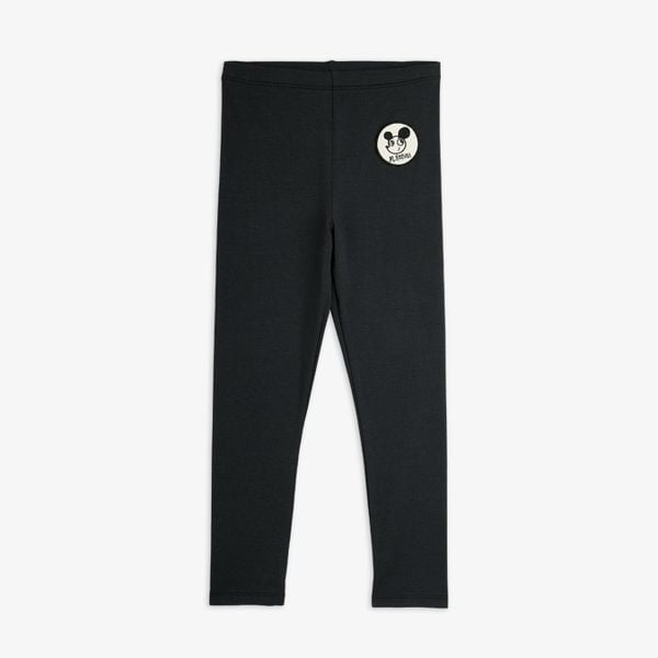 Black organic cotton leggings featuring a Ritzratz character patch on the upper leg.