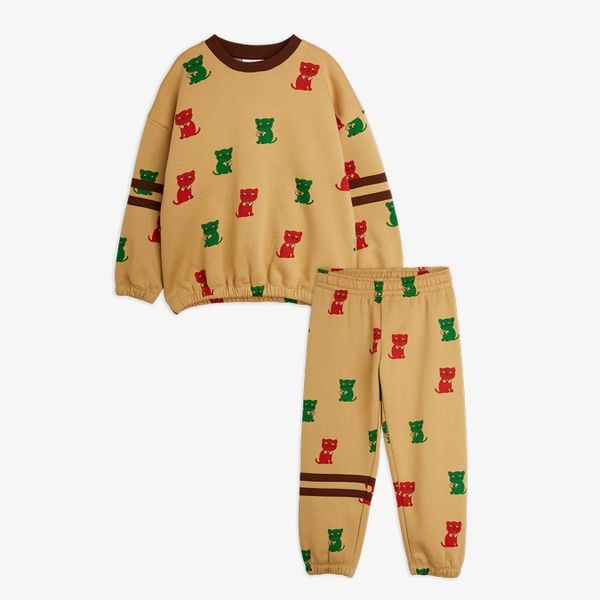 Beige sweatshirt and sweatpants with a red and green Kittens print and brown stripes.