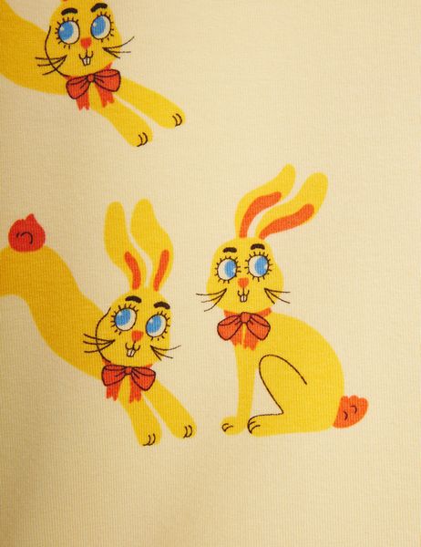 Yellow t-shirt featuring a close-up of the Rabbits print with red bows.