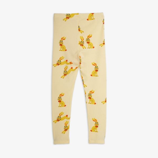 Yellow leggings featuring a repeating Rabbits print and an elastic waistband, back view.