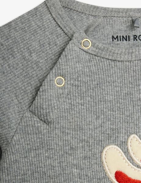Grey melange ribbed bodysuit shoulder with gold snap buttons and a partial rabbit application.