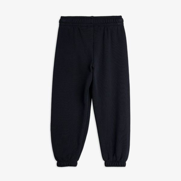 Black sweatpants featuring an elastic waistband and cuffed leg ends, shown from the back.