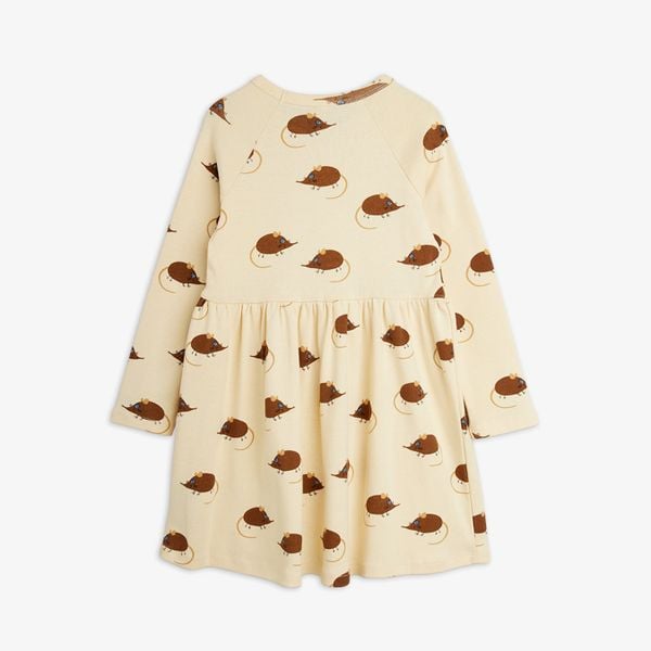 Beige long-sleeved dress featuring an Elephant Shrew print, gathered waist and flared skirt.