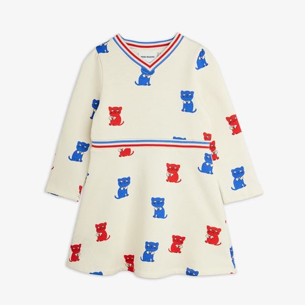 Off-white long-sleeved sweatdress with red and blue Kittens print, striped V-neck and flared skirt.