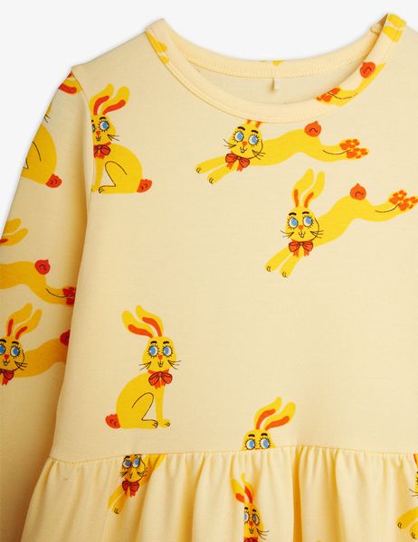 Yellow long sleeve dress featuring an all-over Rabbits print and a gathered waist detail.