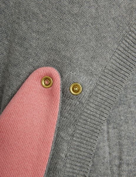 Pink rabbit ear detail and gold snap buttons on the grey melange fine-knit dress.