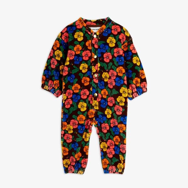 Brown velour onesie with a colorful Violas floral print, front snap buttons, and elasticated trims.
