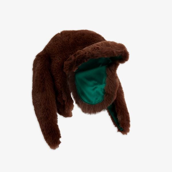 Brown faux fur cap featuring rabbit ears, a front visor, and a vibrant green lining.