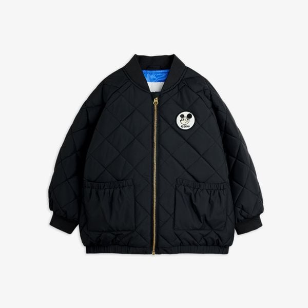 Black quilted puffer jacket featuring a Ritzratz patch, gold zipper, front pockets, and ribbed trims.