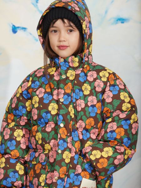 Brown heavy puffer jacket featuring a colorful Violas print and a hood, worn by a child.