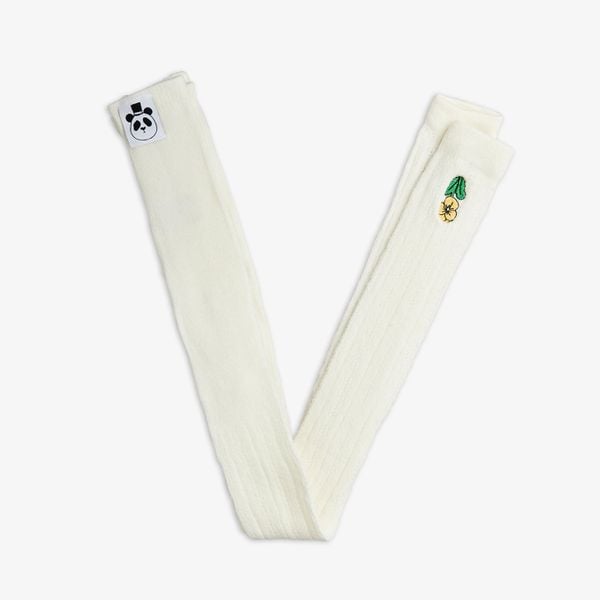 White pointelle leggings featuring a small yellow Viola embroidery and a signature panda logo tag.