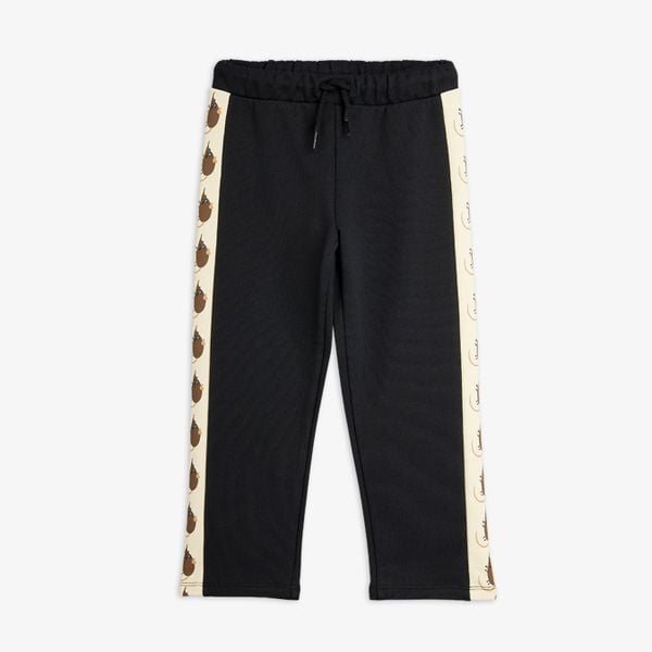 Black organic cotton sweatpants with drawstring waist and side panels featuring the Elephant shrew print.